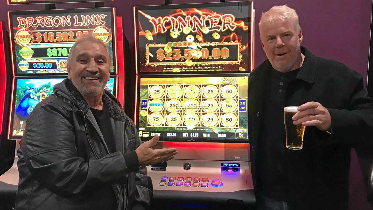 LUCKY DAY: Brisbane Valley Tavern co-owner Frank Amante and jackpot winner Shawn Loy. Shawn walked away with nearly $25,000 last week after an eventful afternoon down at the pub. Picture: Contributed