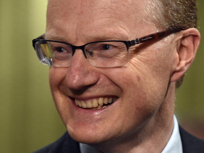 New Reserve Bank of Australia Governor Philip Lowe smiles as he arrives for a parliamentary economics committee hearing in Sydney on September 22, 2016. Lowe said the central bank were not "nutters" about keeping inflation in a tight range, and are instead maintaining a flexible approach as Australia, like other economies, battles low inflation amid subdued oil prices and tepid global trade. / AFP PHOTO / PETER PARKS