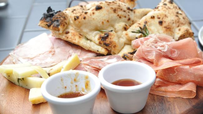 Antipasti board with thinly sliced meats, cheese, focaccia, savoury jam and honey ($26).