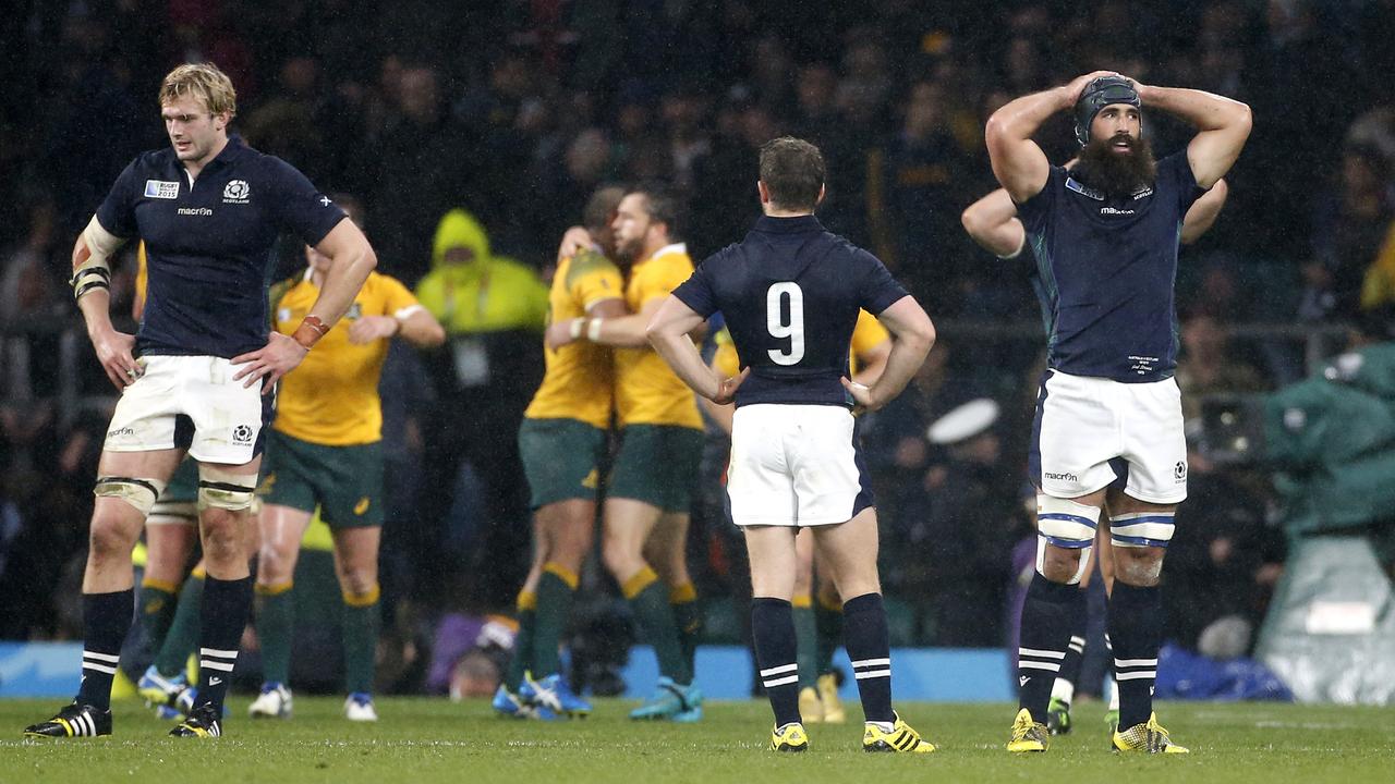 Richie Gray, Greig Laidlaw and Josh Strauss of Scotland look dejected in 2015.
