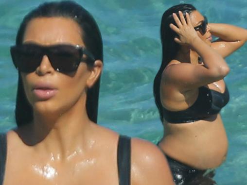 Pregnant Kim Kardashian swims in a natural bathing pool after a 20 minute hike with her sisters and mother in St. Barts. Kim was rewarded with a long relaxing swim in the beautiful blue water filled with sailboats as she ended the hard and long enduring hike. Kim had to join her sisters by swimming quite a ways distance to them as her and Kris had stayed back a bit in the pack to have some mother and daugher time together. The group all then had their heads bopping in the water as they laughed and floated together. The then all were spotted soaking wet in their jogging outfits as Kim took off her main workout top for a bit showing a bit of skin. Khloe and Kourtney showed off their tone bodies in their workout gear that were wet as their trainer chatted with them and joined them for a long walk back up the mountain to the main path. <P> Pictured: Kim Kardashian, Khloe Kardashian, Kris Jenner, Kourtney Kardashian <B>Ref: SPL1105744 190815 </B><BR/> Picture by: Brian Prahl / Splash News<BR/> </P><P> <B>Splash News and Pictures</B><BR/> Los Angeles: 310-821-2666<BR/> New York: 212-619-2666<BR/> London: 870-934-2666<BR/> photodesk@splashnews.com<BR/> </P>