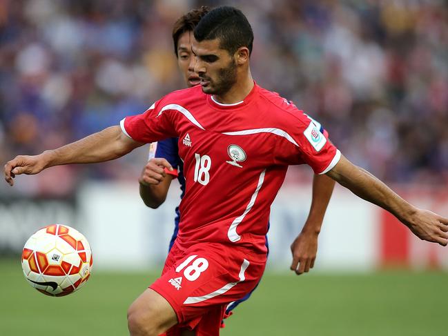 NEWCASTLE, AUSTRALIA - JANUARY 12: Musab Battat of Palestine controls the ball during the 2015 Asian Cup match between Japan and Palestine at Hunter Stadium on January 12, 2015 in Newcastle, Australia. (Photo by Tony Feder/Getty Images)