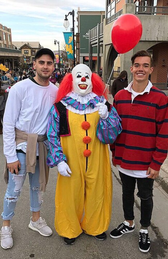 Paul Ahern and Jy Simpkin meet Pennywise the Clown on Halloween. Picture: nmfc.com.au