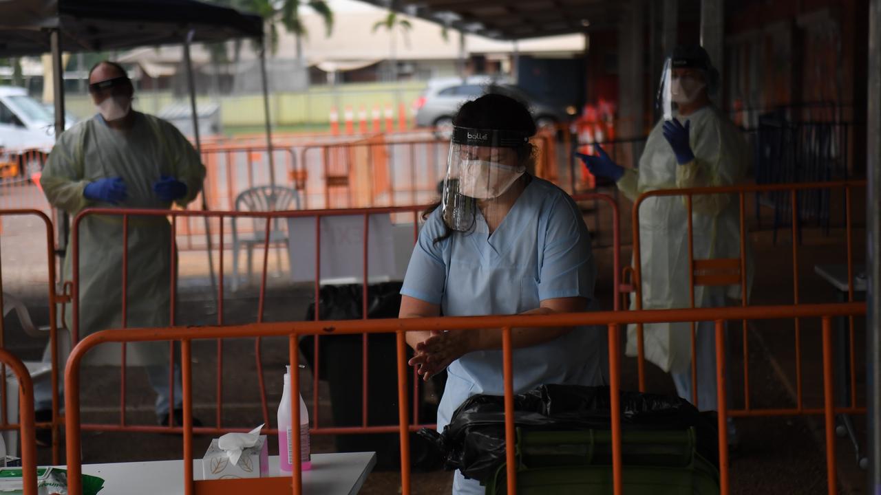 Staff rotate in 30 minute shifts at Katherine East testing clinic as temperatures and humidity climb. Picture: Amanda Parkinson