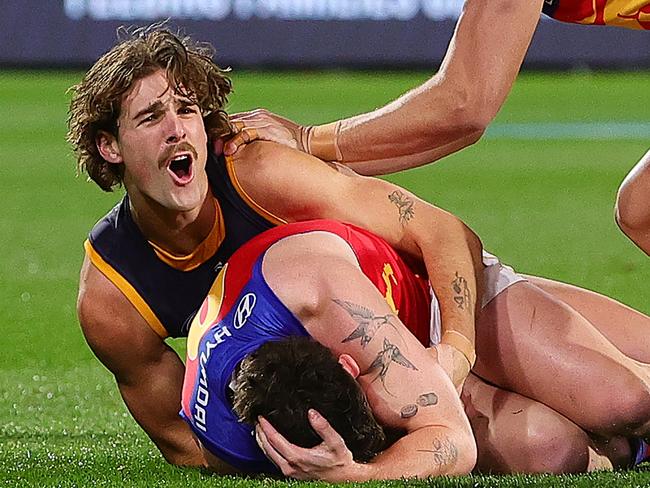 James Peatling reacts after being reported for a tackle on Lachie Neale.
