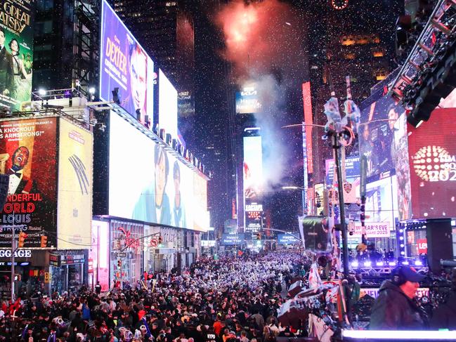 Revelers celebrate the New Year at Times Square in New York City, just after midnight on January 1, 2025. (Photo by Leonardo Munoz / AFP)