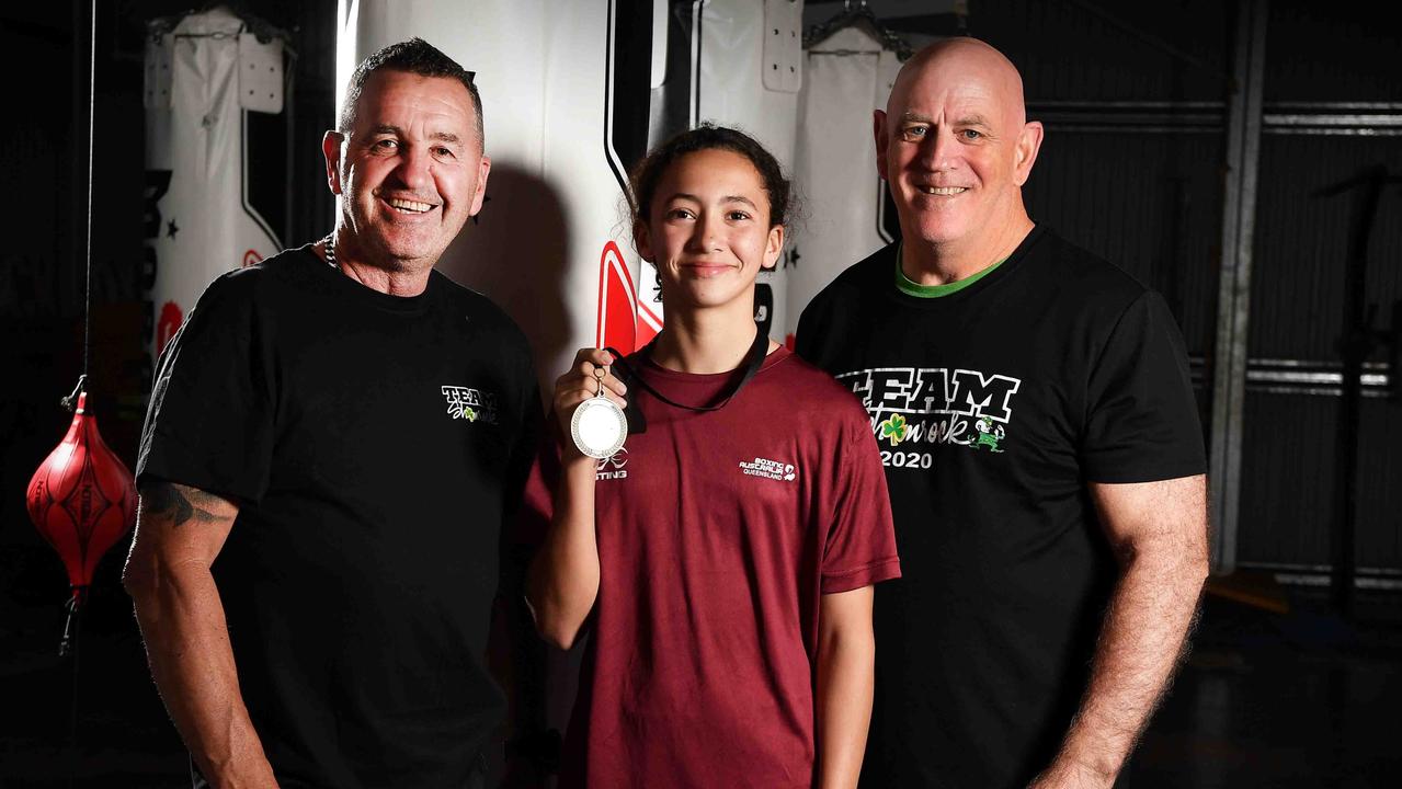 Shamrock Boxing coaches Mike Foley (left) and Kip Daddo (right) with rising boxer Tiana Rew and her gold medal following her win at the Australian titles. Picture: Patrick Woods.