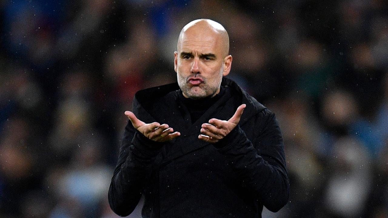 Manchester City's Spanish manager Pep Guardiola reacts during the UEFA Champions League round of 16 second-leg football match between Manchester City and RB Leipzig at the Etihad Stadium in Manchester, north west England, on March 14, 2023. (Photo by Oli SCARFF / AFP)