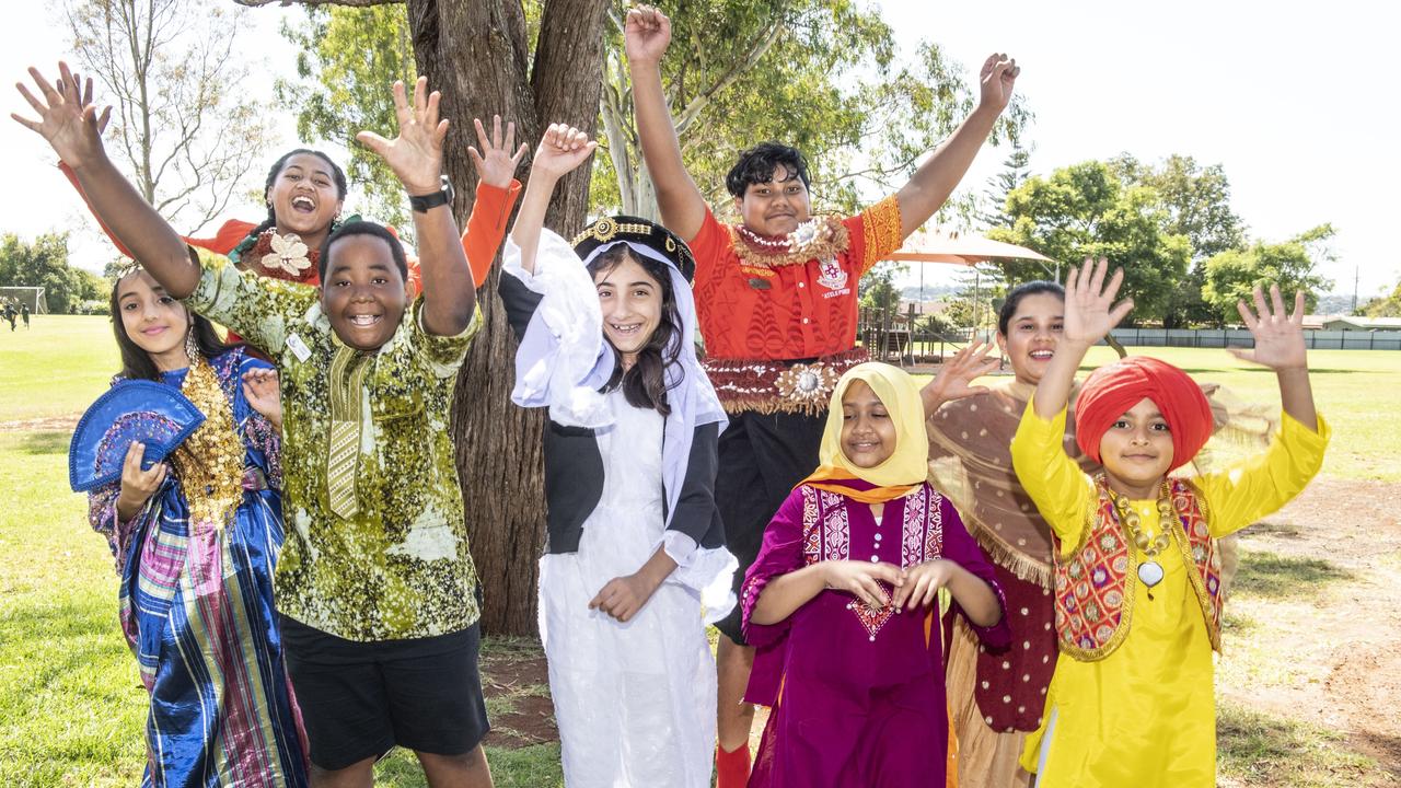 LOVE FOR ALL: (back from left) Hifo Leaaemanu and Koni Leaaemanu (front from left) Aseel Anar, Joshua Tchowe, Raniya Shaibo, Ayesha Muktadir, Saanvi Chauhan and Maneet Singh Braar celebrate Harmony Day at Darling Heights State School assembly. Picture: Nev Madsen.