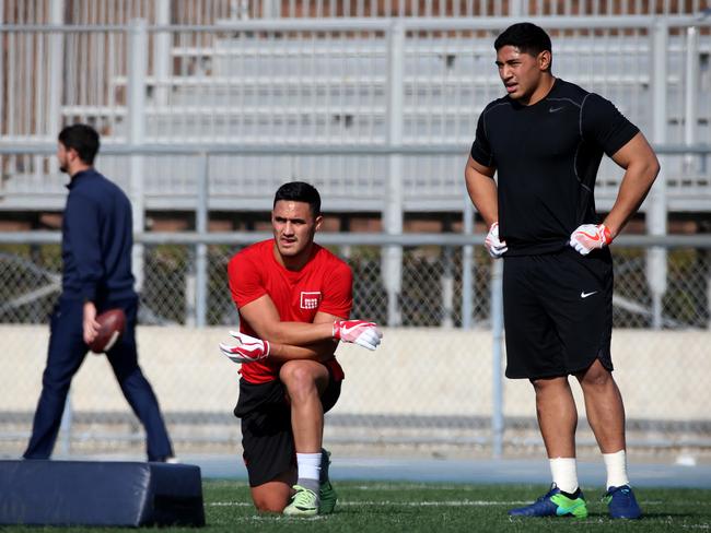 Valentine Holmes and Jason Taumalolo take a breather during their workout. Picture: Nathan Edwards