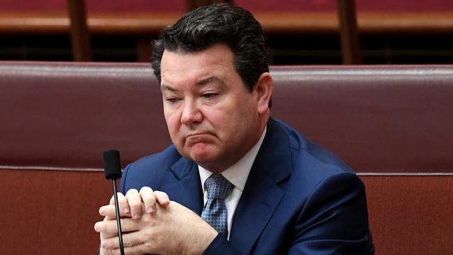 Liberal Senator Dean Smith reacts during debate on the Marriage Equality plebiscite in the Senate chamber at Parliament House in Canberra.