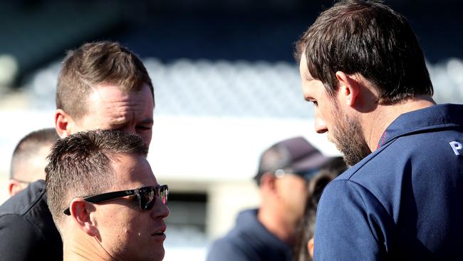 Northern Blues coach Josh Fraser (right) chats to Carlton coach Brendon Bolton.