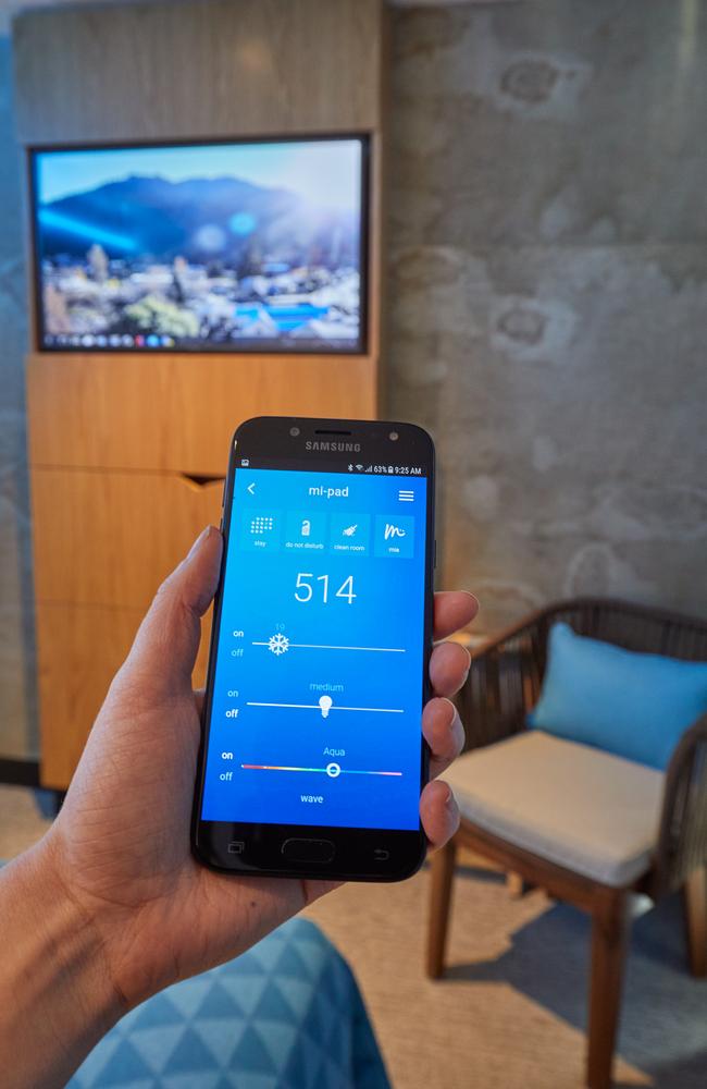 The app can be used as a room key, or to set mood lighting, read what’s going on in Queenstown, message other guests and much more. Picture: Mi-Pad Queenstown