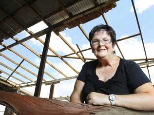 Patrick Estate resident Yvonne Hawkins with some of the wood that came off her shed during a storm. Picture: Sarah Harvey