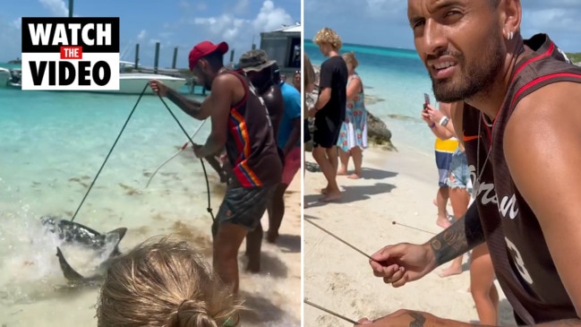 Nick Kyrgios tests his strength against a shark