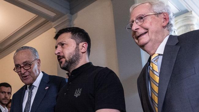 US Senate Majority Leader Chuck Schumer, left, Senate Minority Leader Mitch McConnell, right, with Mr Zelensky in Washington on Thursday (AEST). Picture: Getty Images