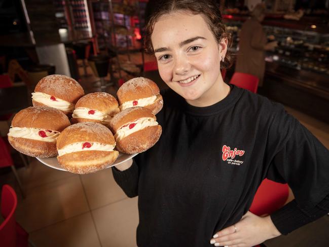 Norwood’s Enjoy Cafe worker Stella Glynn holding Kitchener buns. Picture: Emma Brasier