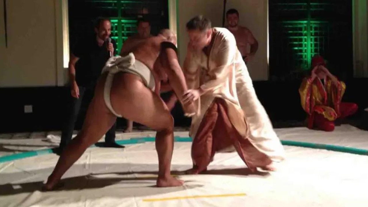 Elon Musk taking on a sumo wrestler.
