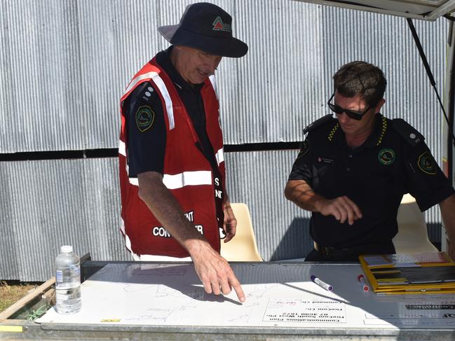 Incident controller Warren Dean with Warwick Brigade Support Officer Adam Smith drafting a plan