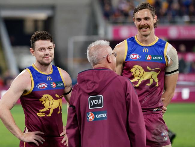 Brisbane coach Chris Fagan talks with Lachie Neale and Joe Daniher after the win over Melbourne. Picture: Russell Freeman/AFL Photos