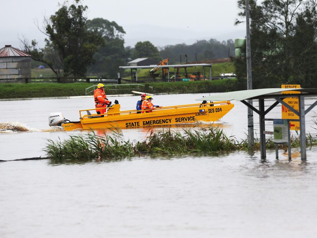 SES crew motor up a flooded Williams River, near Raymond Terrace, to check on stranded stock in NSW. Picture: NCA NewsWire / Peter Lorimer.