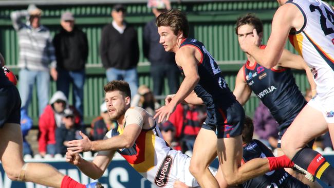 Adelaide's Bryce Gibbs gets a handball away. Picture: AAP Image/Russell Millard