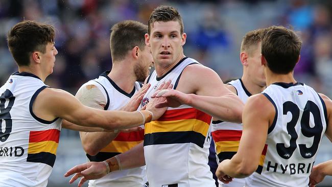 Jenkins celebrates with teammates in Round 12, 2018 – a few months after the camp. Picture: Paul Kane/Getty Images