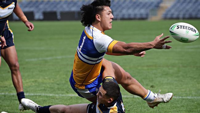 DAILY TELEGRAPH AUGUST 30, 2023. Patrician Brothers Blacktown getting tackled by a Westfields Sports High player during the final for the Peter Mulholland Cup at Campbelltown Stadium.  Picture: Adam Yip