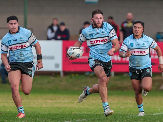 Cronulla's Tom Carr breaks clear during the first half. Picture: Adam Wrightson Photography