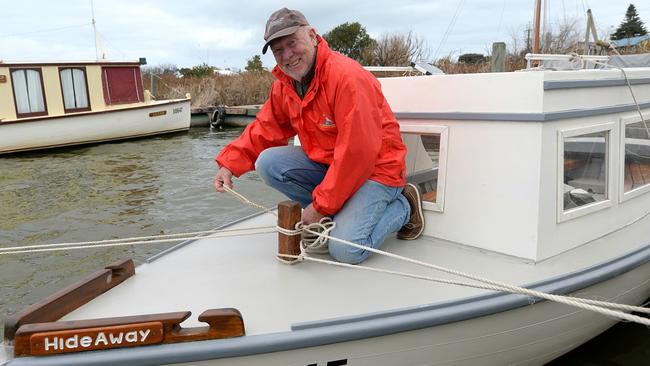 NEW LIFE: Bob Jennings, volunteer and committee member at Armfield Slip and Boatshed, with Hideaway, the boat used in the original Storm Boy movie. Volunteers from the group rescued its wreck and have fully restored it. Picture: Bernard Humphreys