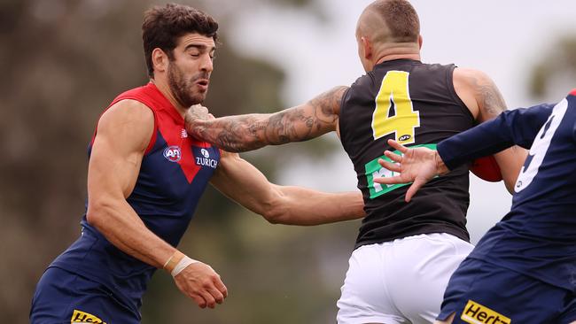 Dusty gave Petracca one of his trademark fend-offs during the pre-season. Picture: Michael Klein