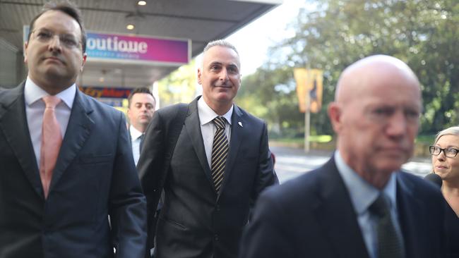 Liberal MP John Sidoti (centre with black stripy tie) and his legal team arriving at his ICAC hearing earlier int he week. Picture: NCA NewsWire / Christian Gilles