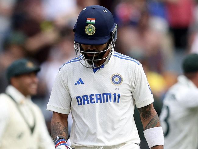 TOPSHOT - India's Virat Kohli leaves the field after being dismissed on day two of the fourth cricket Test match between Australia and India at the Melbourne Cricket Ground (MCG) in Melbourne on December 27, 2024. (Photo by Martin KEEP / AFP) / --IMAGE RESTRICTED TO EDITORIAL USE - STRICTLY NO COMMERCIAL USE--