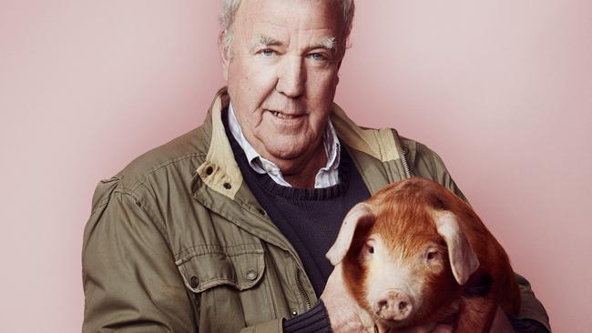 Besotted: <span id="U724131993312b0B" style="font-family:'NeueHaasGroteskDisp Std';font-weight:450;font-style:normal;">Jeremy Clarkson with one of his prized pigs. Picture: The Sunday Times</span>