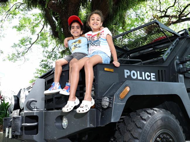 Cairns police have hosted a community engagement day, where members of the public can meet the officers and get up close to police vehicles, including buggies, motorbikes, boats and the Bearcat armoured vehicle. Cousins Jairus Mara and Avaini Lewis got a good look at the Queensland Police Bearcat armoured vehicle when it was parked on the Cairns Esplanade. Picture: Brendan Radke