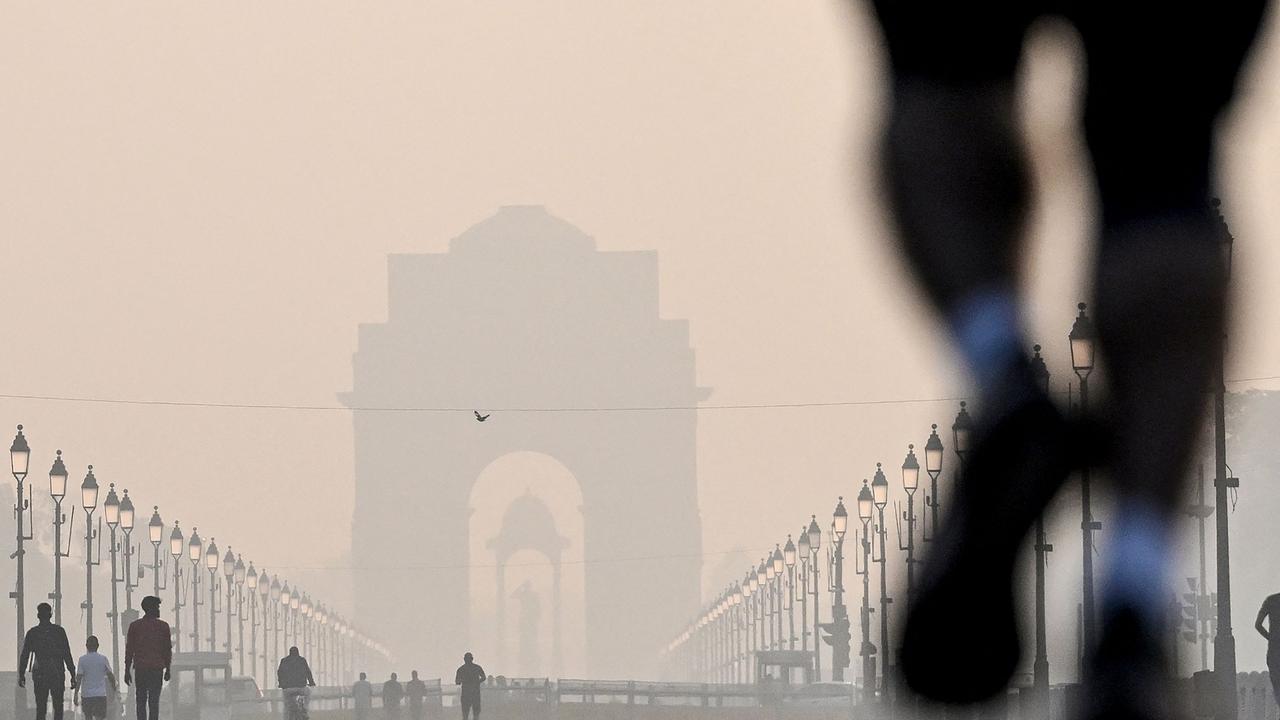 Pedestrians walk near the India gate amid smoggy conditions after Diwali, the Hindu Festival of Lights, in New Delhi on November 1, 2024. Picture: AFP