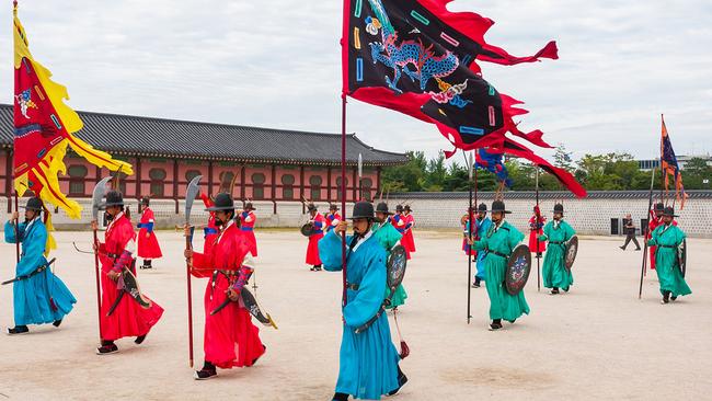 Guards in blue, red and yellow perform the twice daily.