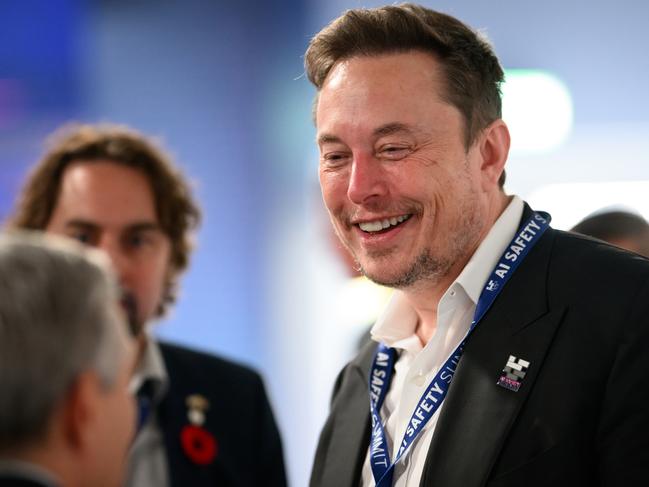 BLETCHLEY, ENGLAND - NOVEMBER 01: SpaceX, X (formerly known as Twitter), and Tesla CEO Elon Musk speaks with other delegates during day one of the AI Safety Summit at Bletchley Park on November 01, 2023 in Bletchley, England. The UK Government are hosting the AI Safety Summit bringing together international governments, leading AI companies, civil society groups and experts in research to consider the risks of AI, especially at the frontier of development, and discuss how they can be mitigated through internationally coordinated action. (Photo by Leon Neal/Getty Images)