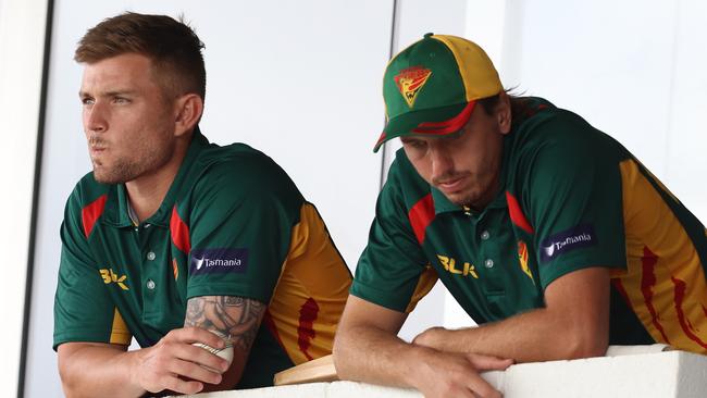 Ben McDermott and Sam Rainbird look on from the players’ rooms during the match against Western Australia. Picture: Paul Kane/Getty Images