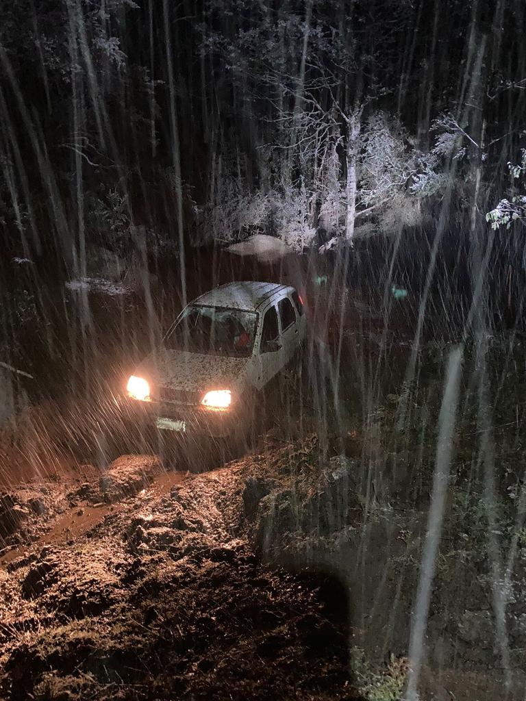 Police help rescue two families stuck in snow at Lachlan. Pic: Tasmania Police.