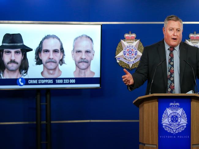 Detective Inspector Dean Thomas in front of the digital images of a man they want to speak to in relation to Mr Cooper’s murder and how he might have aged over the years. Picture: Ian Currie