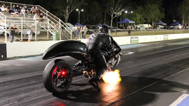 Flames spit from the exhaust of Matt Walker's turbocharged Suzuki Hayabusa as he prepares to launch at Benaraby dragway. Picture: Rodney Stevens