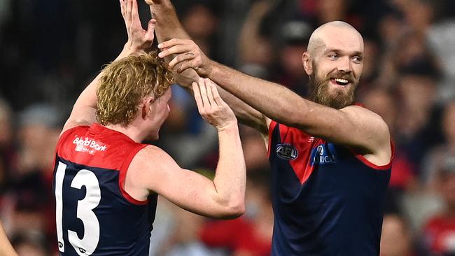 MELBOURNE, AUSTRALIA - APRIL 16: Max Gawn of the Demons is congratulated by Clayton Oliver after kicking a goal during the round five AFL match between the Melbourne Demons and the Greater Western Sydney Giants at Melbourne Cricket Ground on April 16, 2022 in Melbourne, Australia. (Photo by Quinn Rooney/Getty Images)