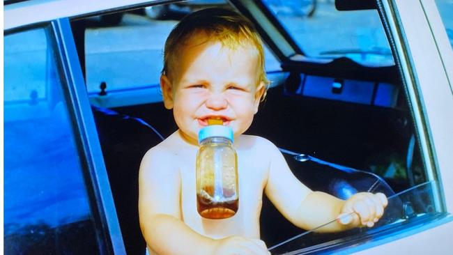 Happily drinking straight Coke in the baby bottle. Image: Melissa Noble