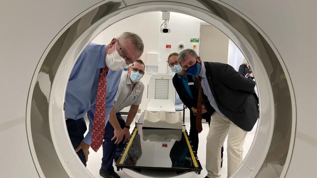 Mark Coulton, nursing unit manager Tim Williams, deputy chief of radiation therapy Catherine Osbourne and David Gillespie inspect the linear accelerator radiation treatment machine at Dubbo's Western Cancer Centre. Picture: Ryan Young