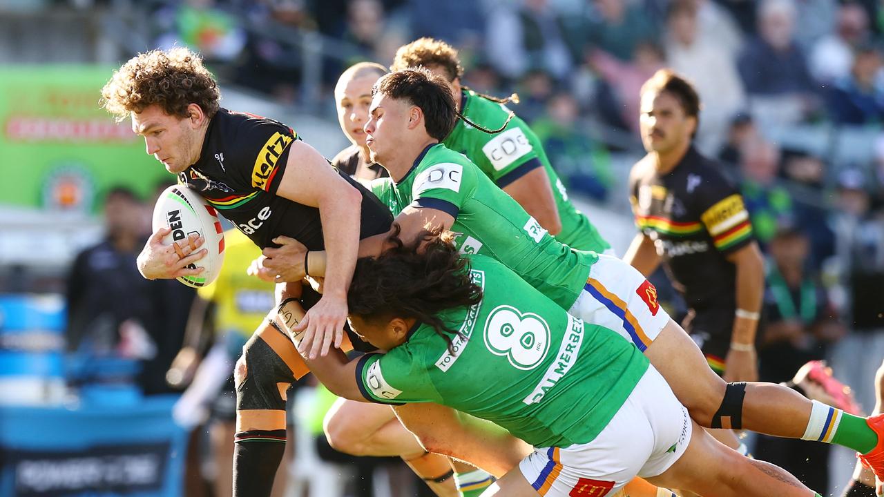 CANBERRA, AUSTRALIA - AUGUST 24: Liam Martin of the Panthers is tackled during the round 25 NRL match between Canberra Raiders and Penrith Panthers at GIO Stadium, on August 24, 2024, in Canberra, Australia. (Photo by Mark Nolan/Getty Images)