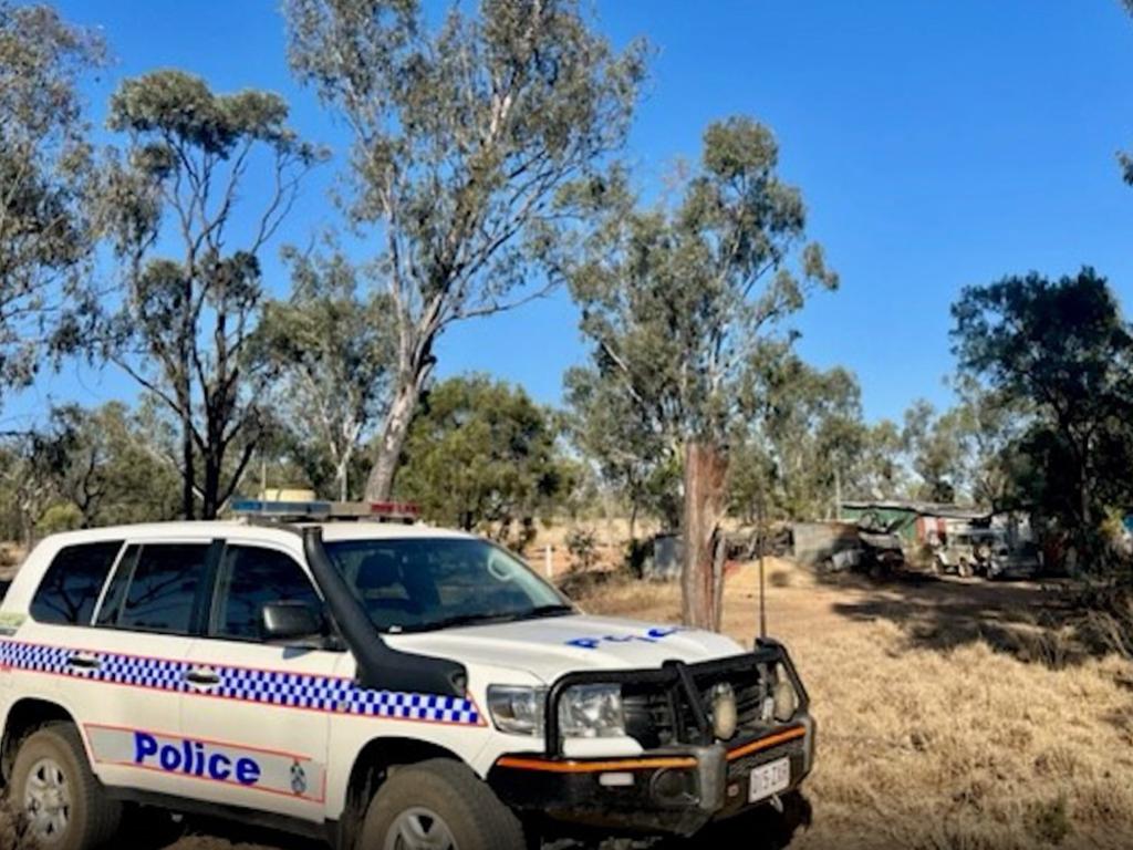 Queensland Police search a dry creek in Reward, near Rubyvale, where the human remains of Francis "Frank" Foley were found last year.