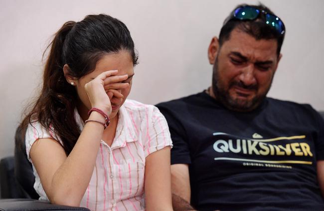 Maria Maillis and Charlie Maillis cry as they talk about their uncle, Michael Sisois, who was one of four men killed in a tragic Darwin shooting. Picture: Keri Megelus