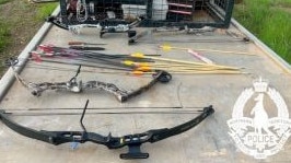 NT Police allegedly seized a small trove of weapons including 10 bows, five crossbows, 300 arrows, machetes, hunting knives and even a sword. Picture: supplied.