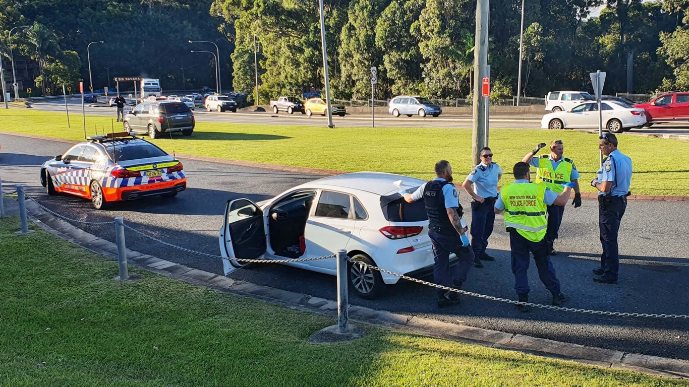 Officers from Coffs/Clarence Traffic and Highway Patrol following an alleged high speed pursuit which started at Glenugie and ended near the Big Banana at Coffs Harbour. Photo: Frank Redward